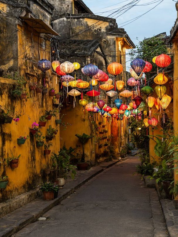 Hoi An ancient town at dusk, lanterns by the river